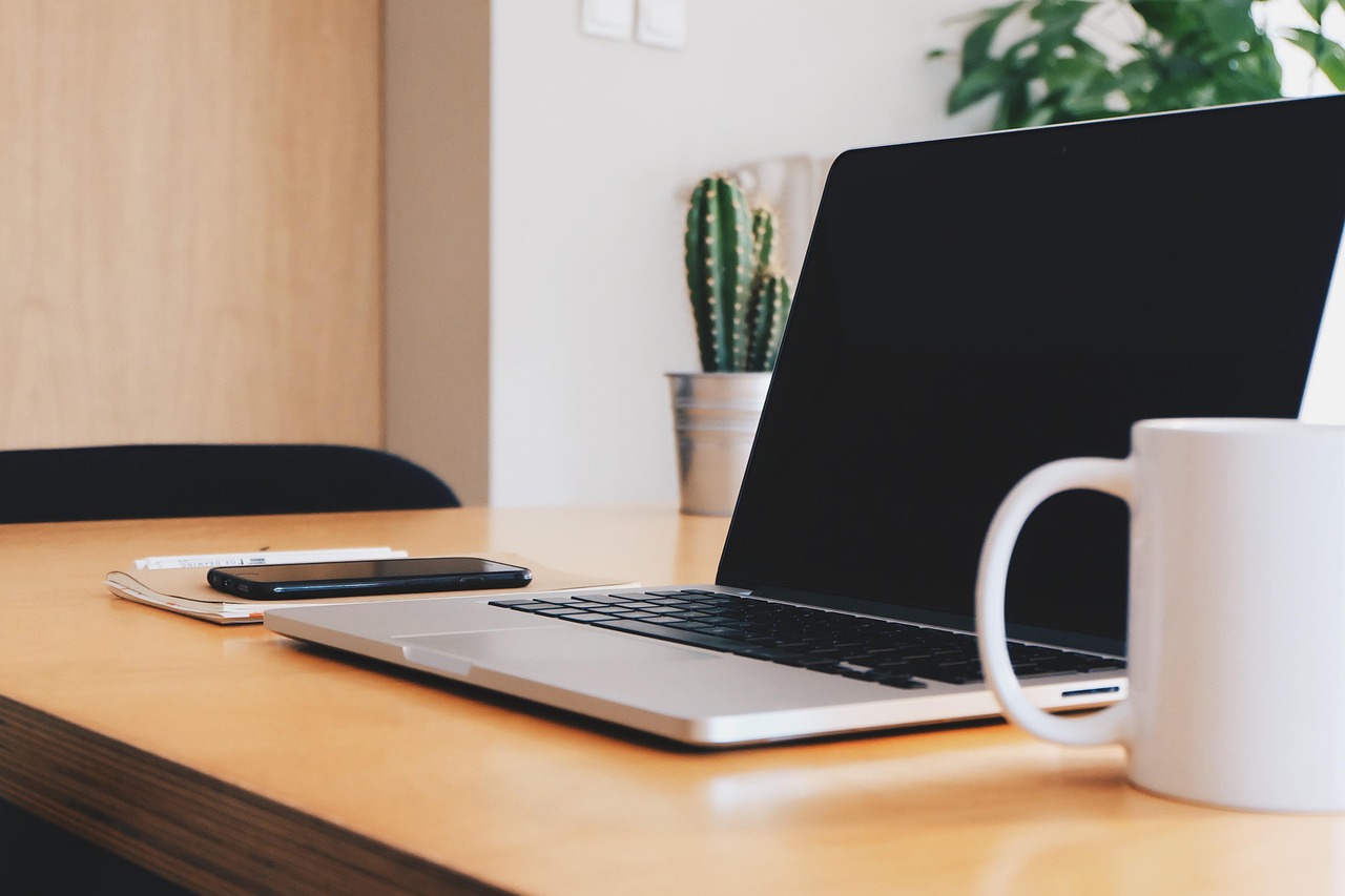 Office, desk, coffee cup — Five ways of having a lawyer can help you in many ways