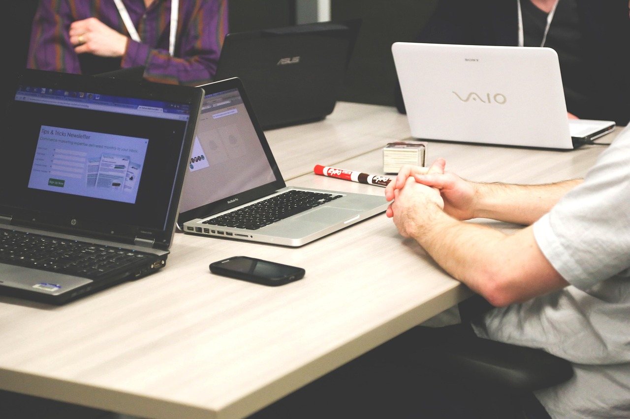 Laptops, meeting, businessmen — Professional Huntsville financial advisor