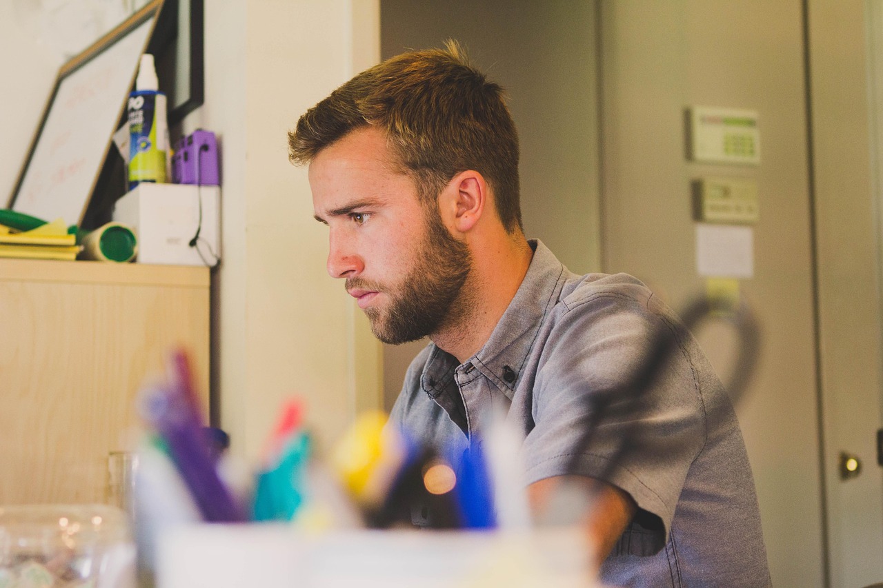 Man, work, desk — Why You Need the Best CRM System Going On Now